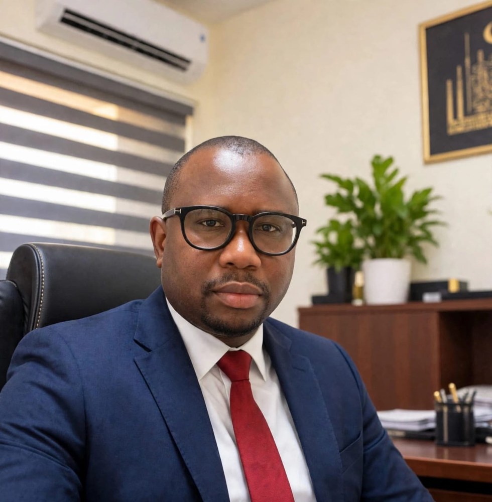 Lamin M. Ceesay, CEO of Lamino Business Center, at his office desk